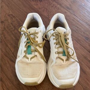 White and Tan Athletic Shoes